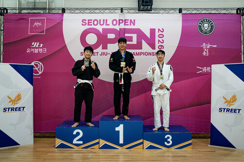On the podium at a Jiu-Jitsu competition